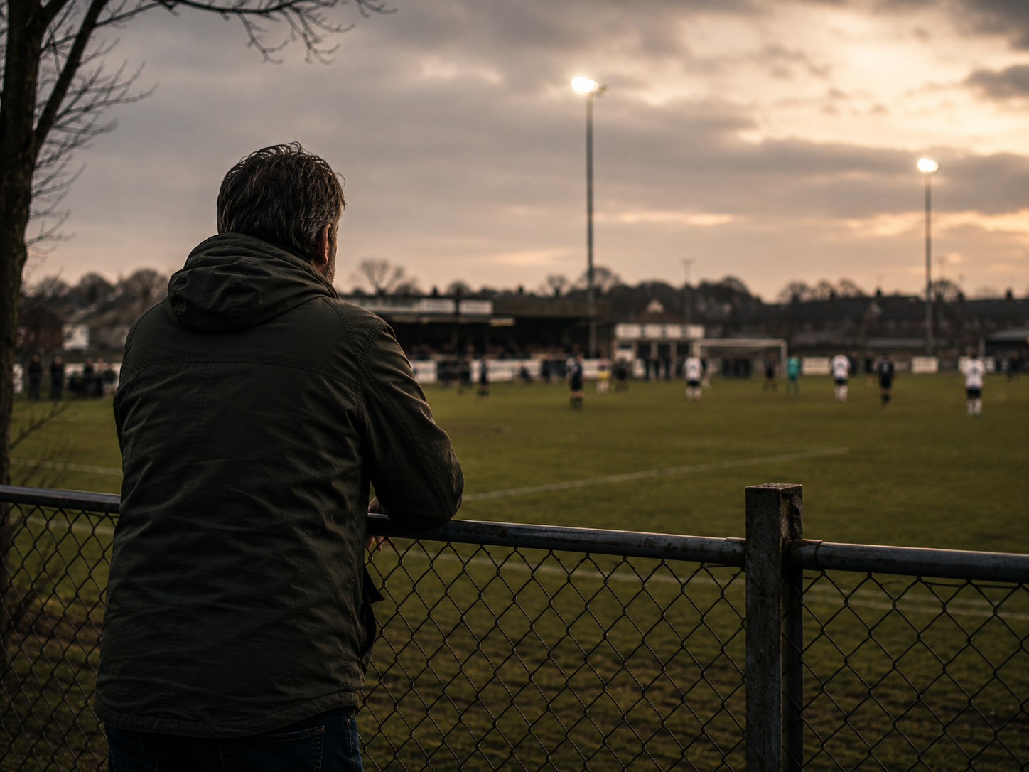 A football ground at dusk.